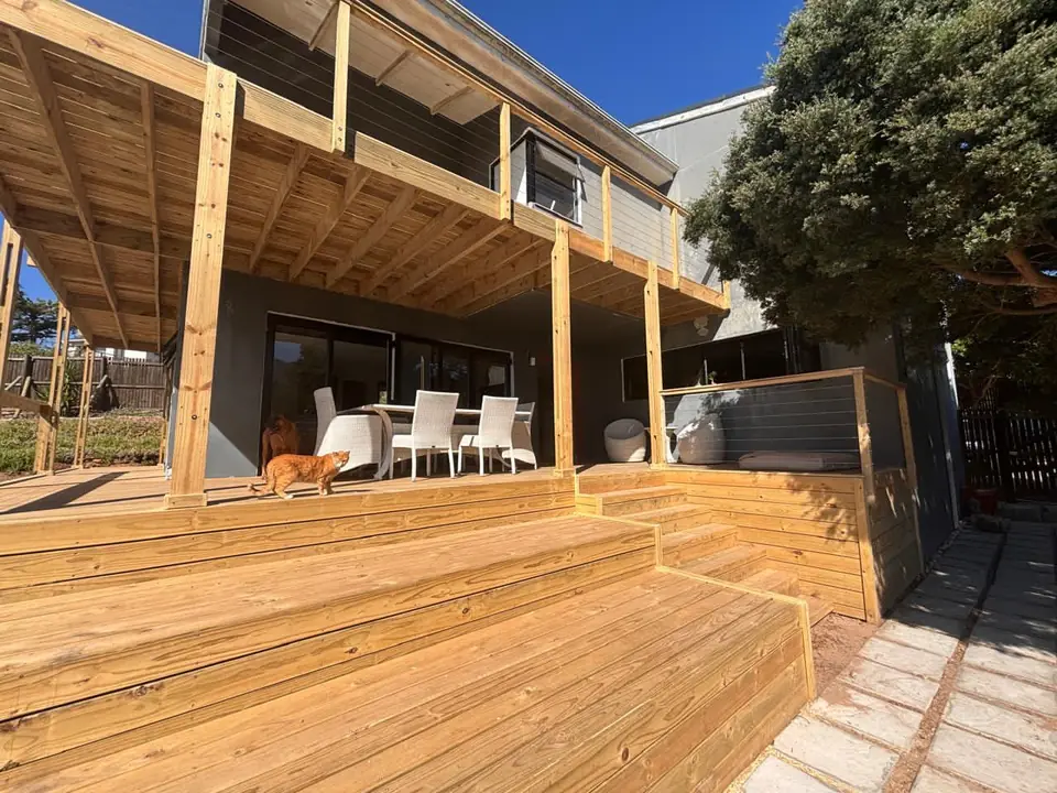 Covered timber deck with an outdoor dining table