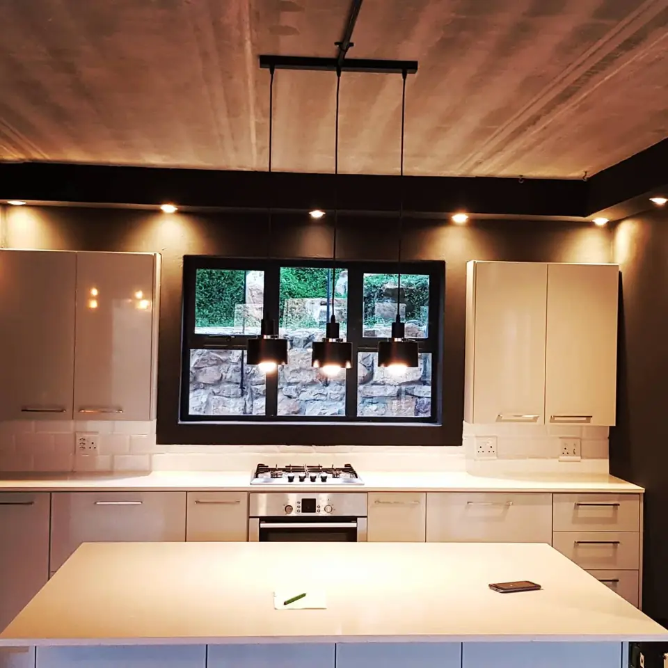 Modern kitchen with a long island and pendant lights