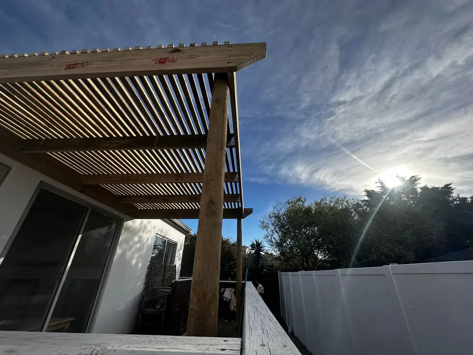 Slatted timber pergola over a patio
