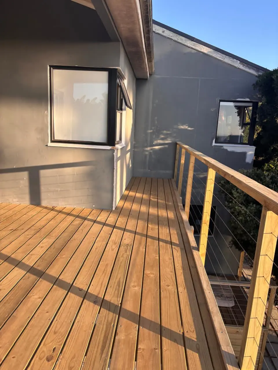 Timber balcony deck with a cable balustrade