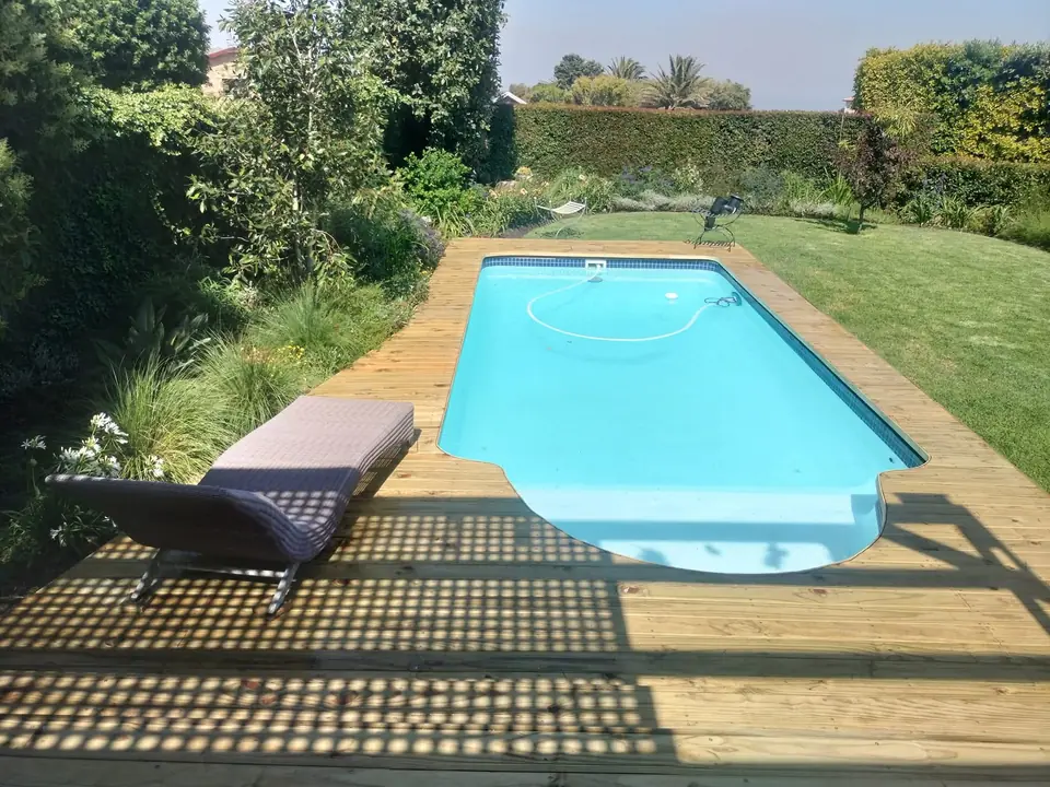 Timber pool deck with a lounger