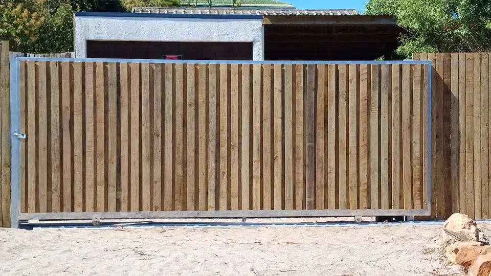 Timber sliding gate on a steel frame